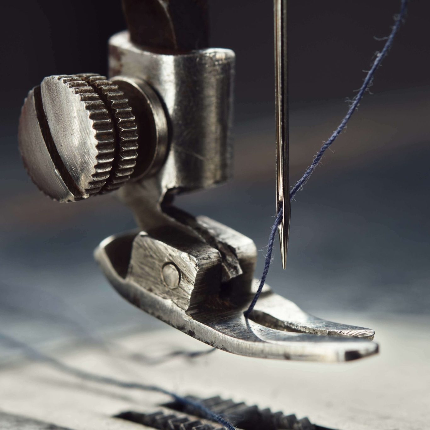 Sewing Machine Foot and Needle Close Up of Sewing Machine Foot, Needle point and thread